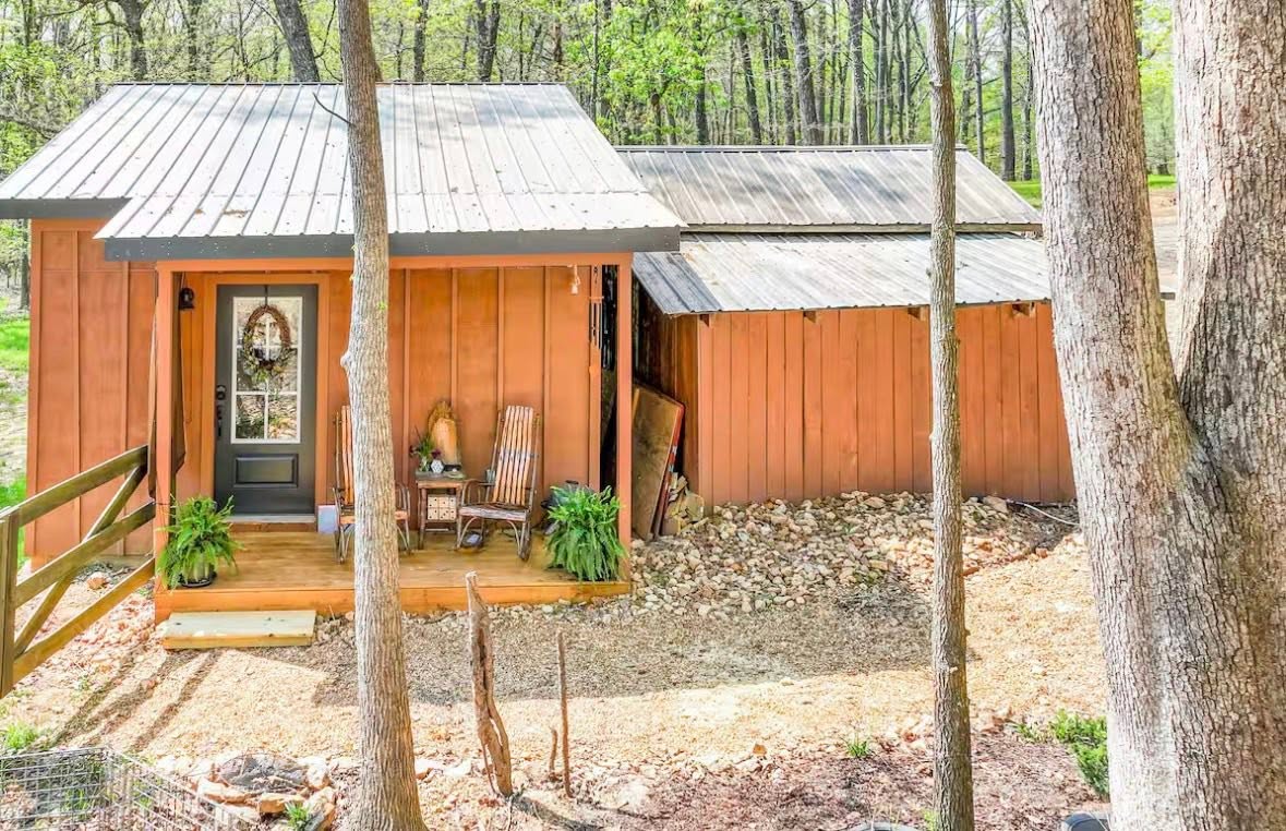 The cabin tucked into the trees